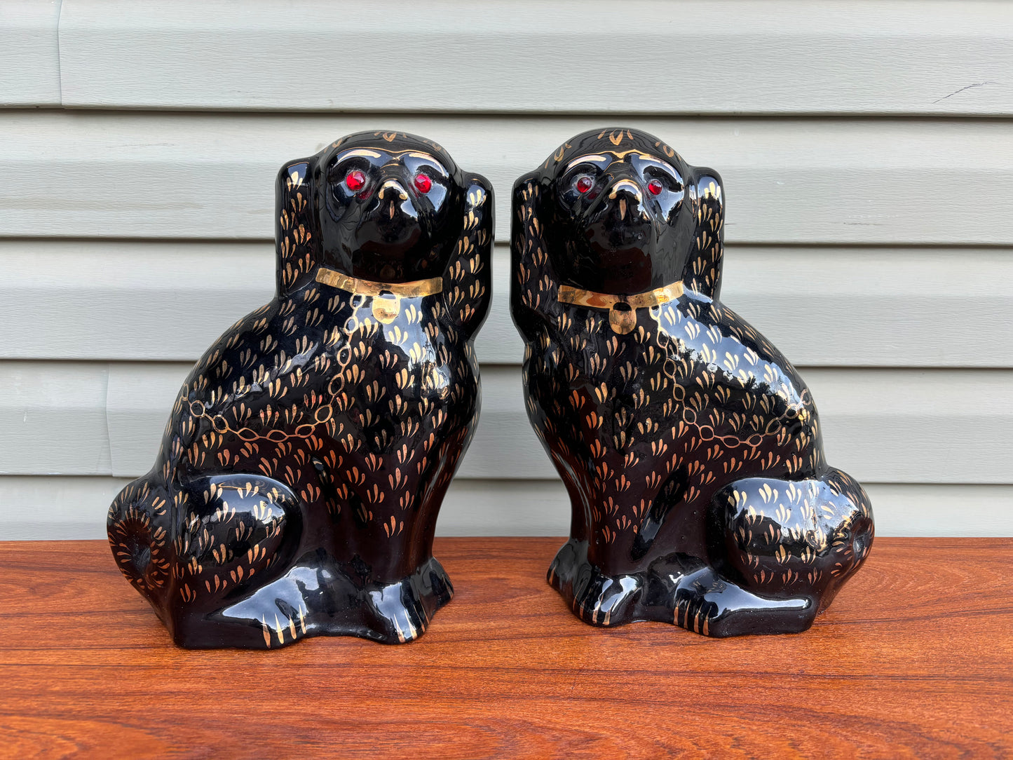Pair of Black and Gold Staffordshire Style Ceramic Dogs